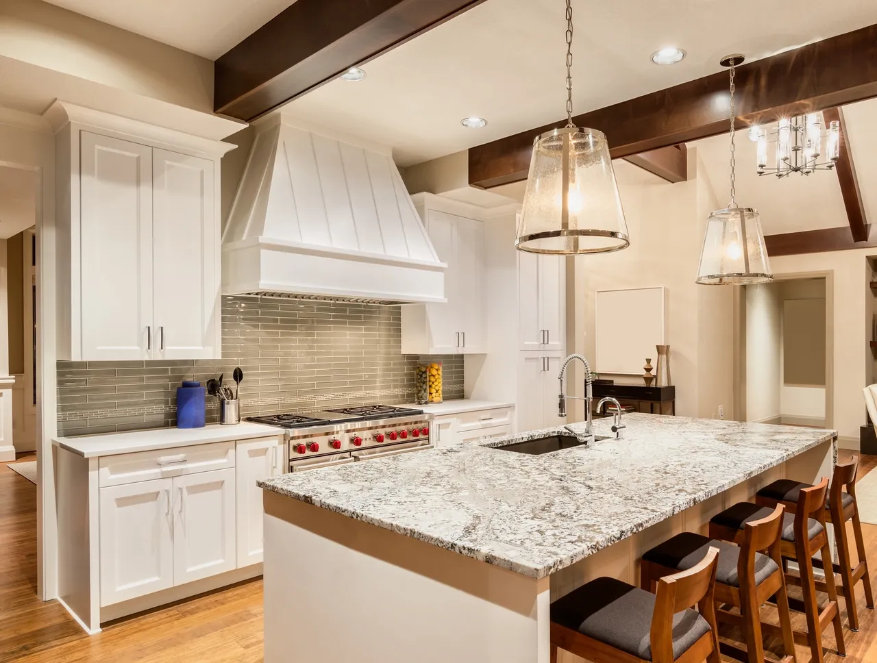 Stone kitchen island under exposed oak beams